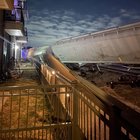 (freight?) train fully derailed from the metro rail line, crashed through apartment building fence