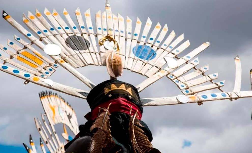 A colorful Native American headdress adorned at the American Indigenous Arts Celebration.