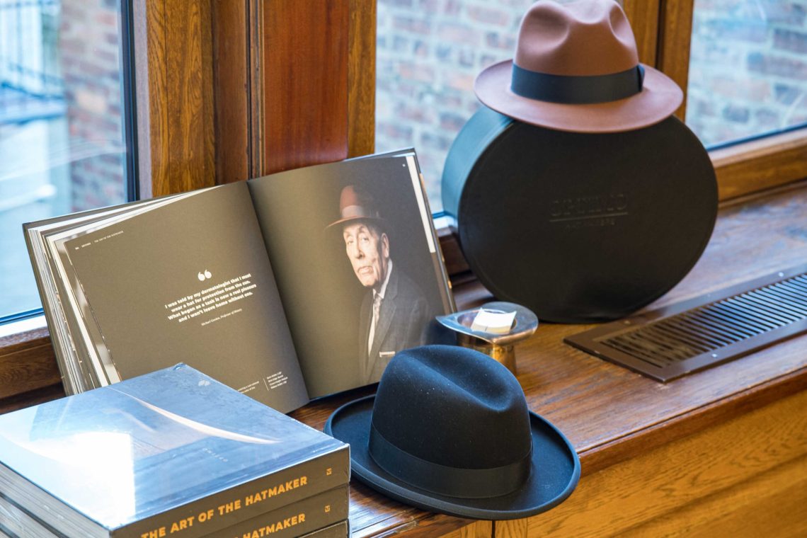 Optimo hats and their book.