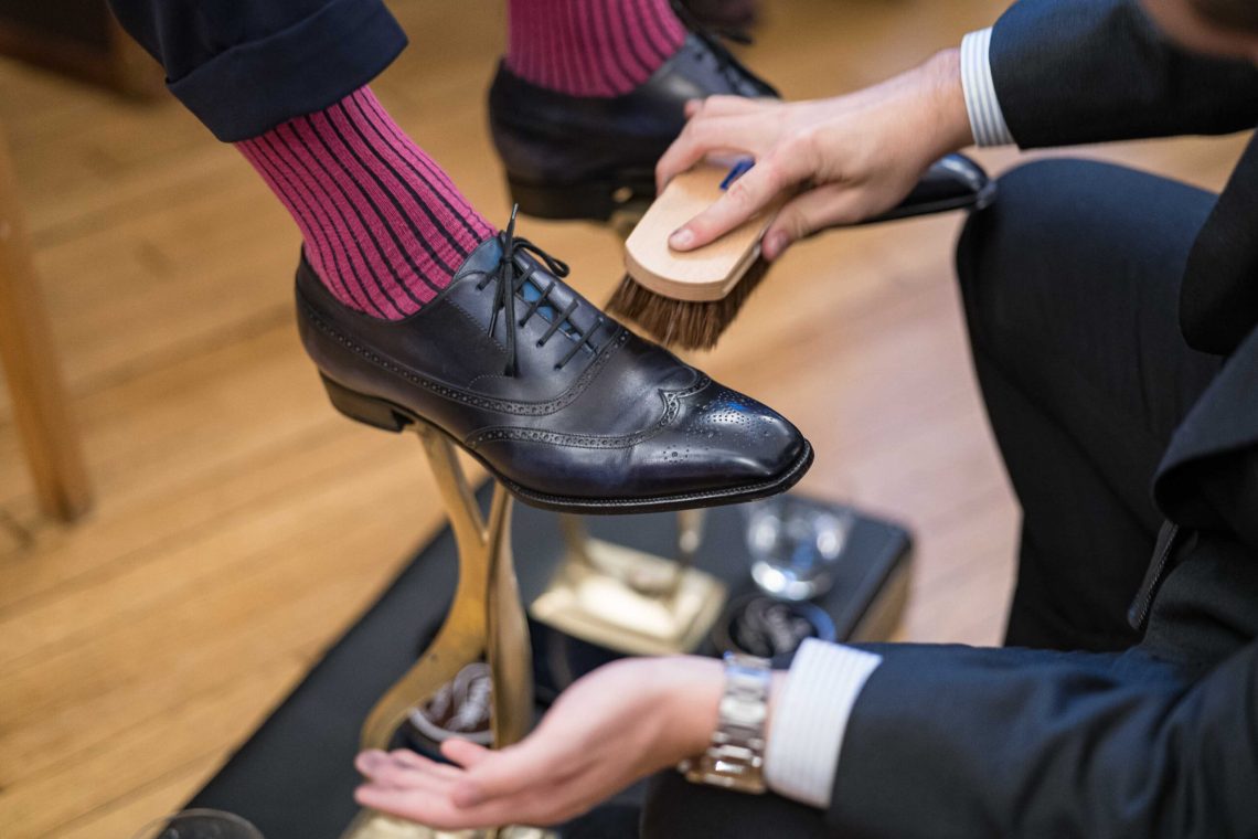 A pair of Yohei Fukuda shoes getting a free shoe shine.