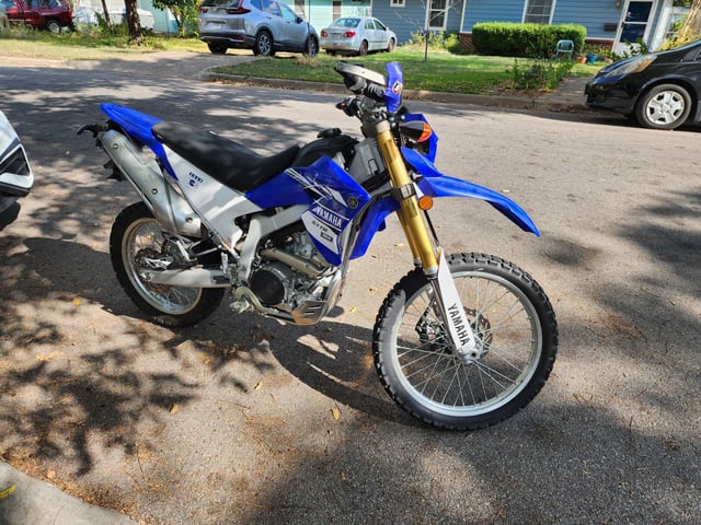 Hot wired dirt bike stalled in front of my house