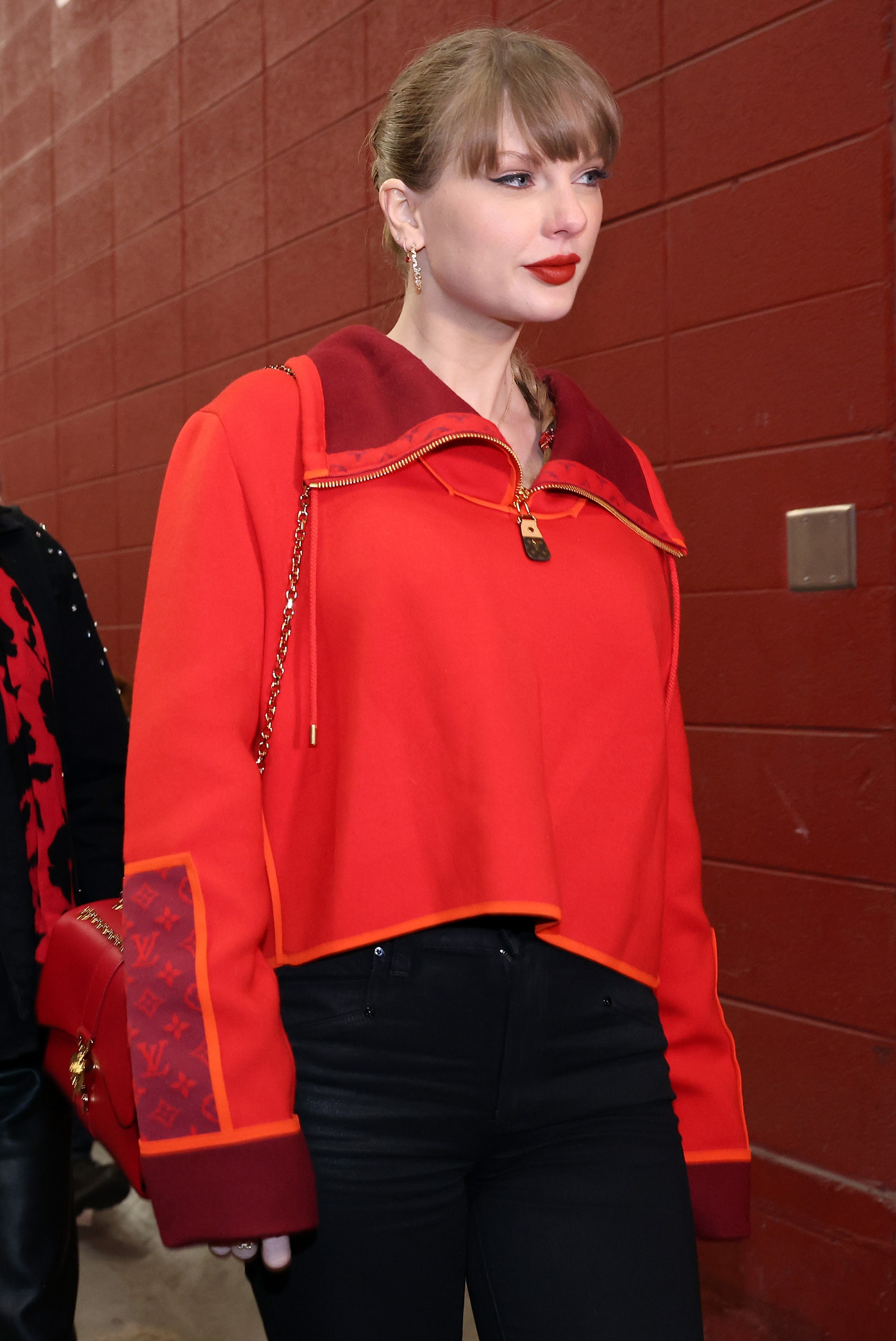 Image may contain Taylor Swift Blouse Clothing Coat Jacket Adult Person Long Sleeve Sleeve Accessories and Bag