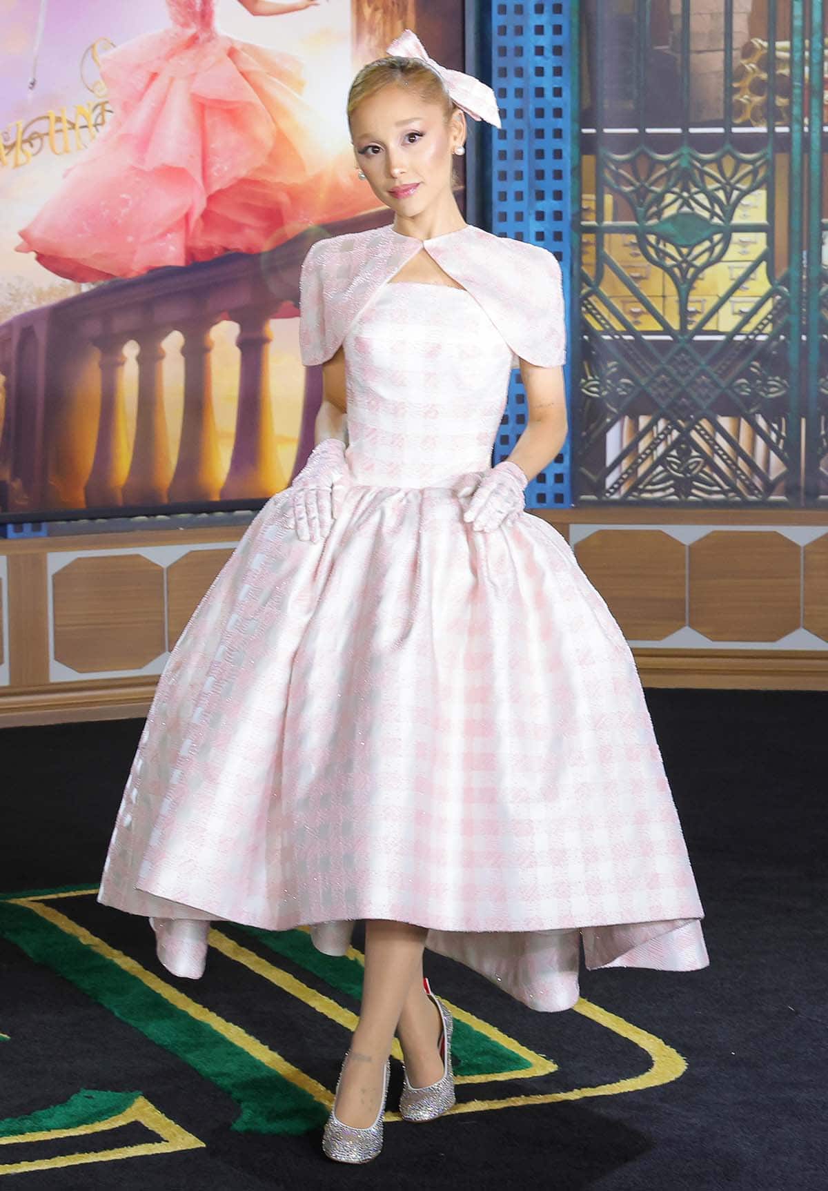 Ariana Grande looks demure in a white-and-pink gingham-patterned Thom Browne dress, hand-embroidered with 50,000 pink crystals, beads, and silk thread