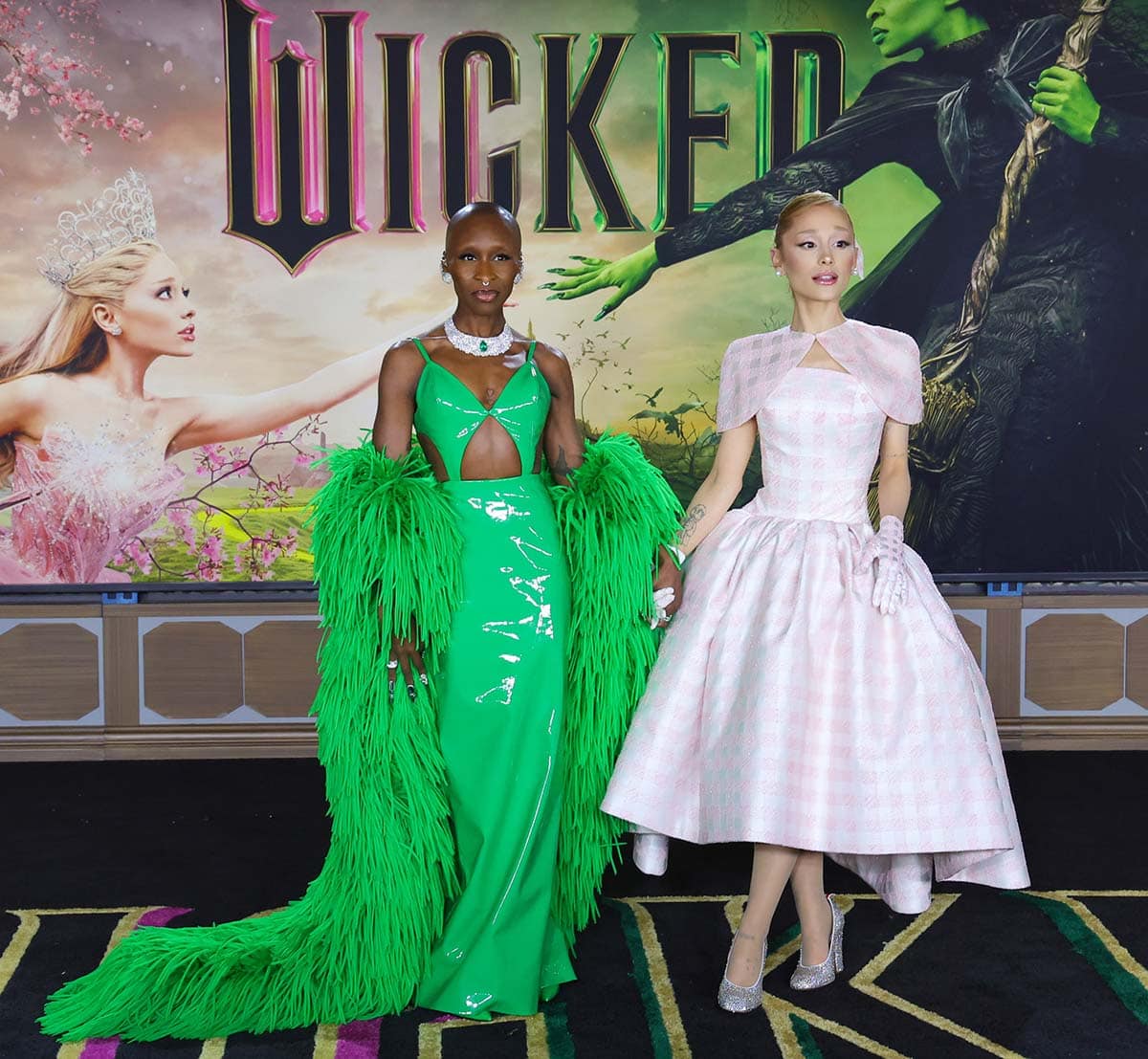 Cynthia Erivo and Ariana Grande channel their characters, Elphaba and Glinda, at the Los Angeles premiere of Wicked at the Dorothy Chandler Pavilion