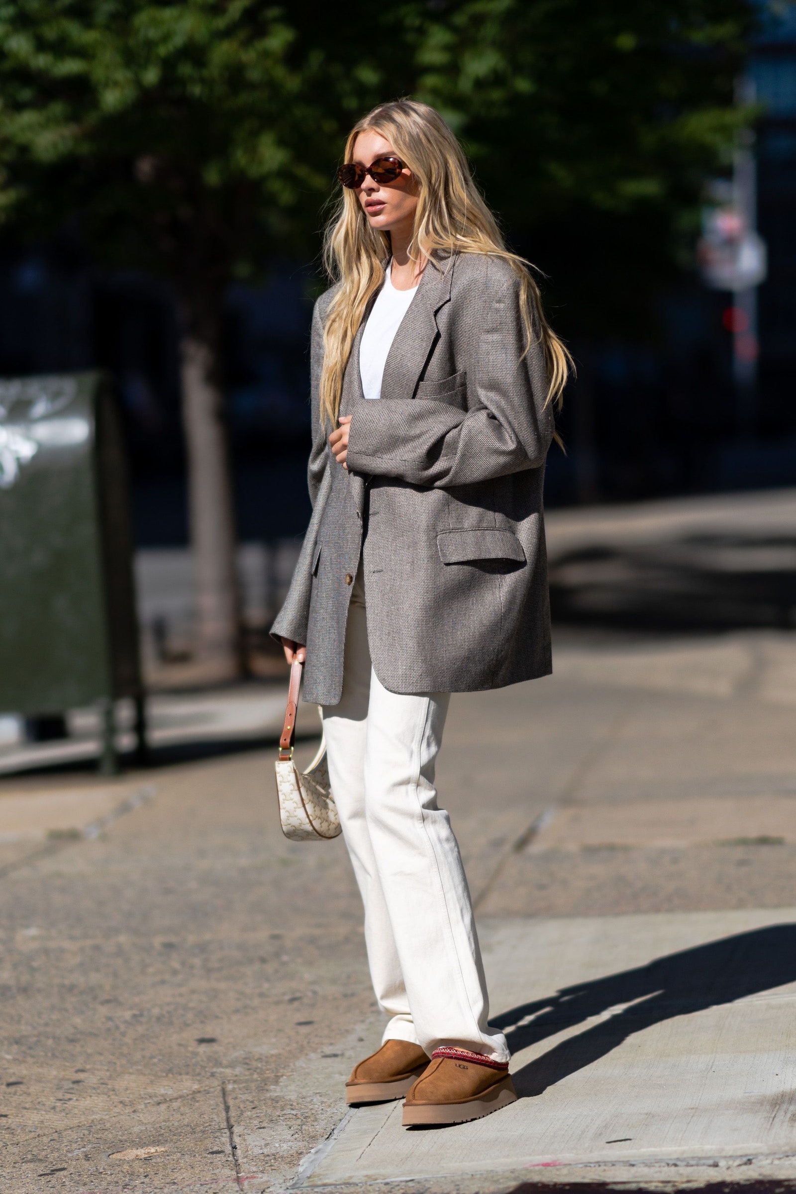 Image may contain Elsa Hosk Blazer Clothing Coat Jacket Formal Wear Suit Accessories Bag Handbag and Pants