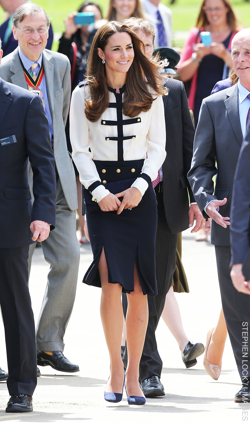 Kate Middleton wearing a military-style blouse and skirt at Bletchley Park in 2014.