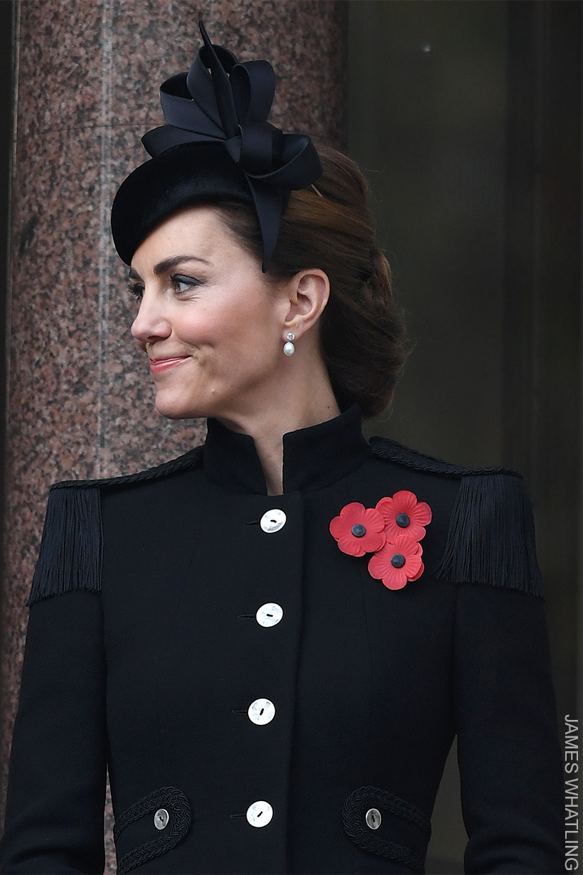 Kate Middleton wearing three poppies pinned to her coat on Remembrance Sunday