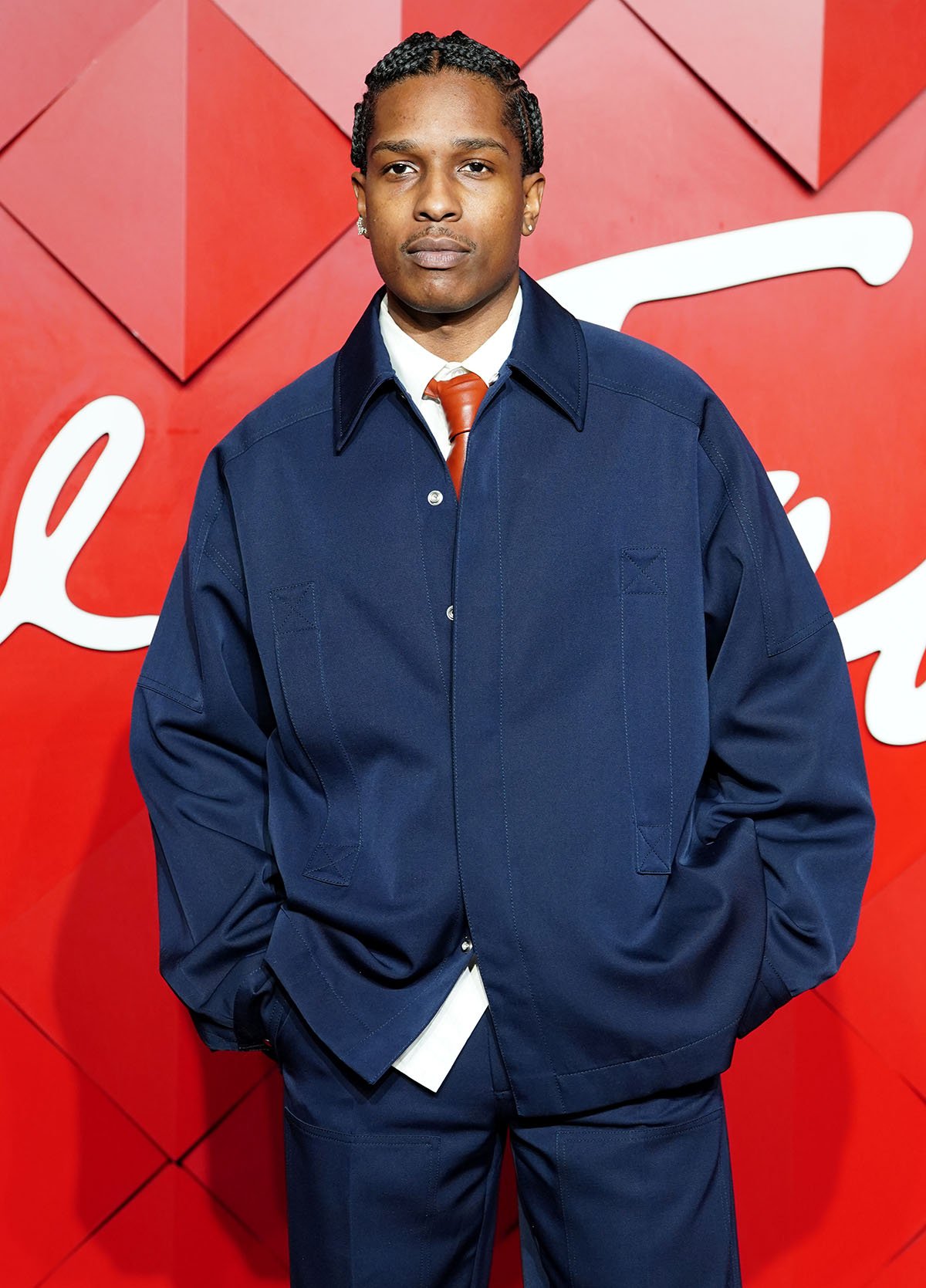 A$AP Rocky, Cultural Innovator Awardee, looks cool in a loose-fitting navy blue Bottega Veneta jacket and matching trousers