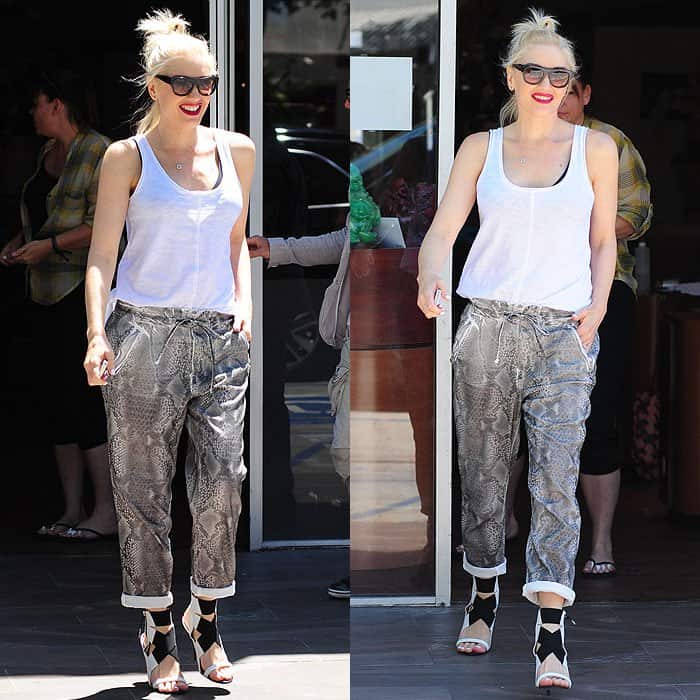 Gwen Stefani nails casual-cool style in baggy snake-print pants, a white tank, and statement heels while leaving a nail salon in Hollywood on May 15, 2014