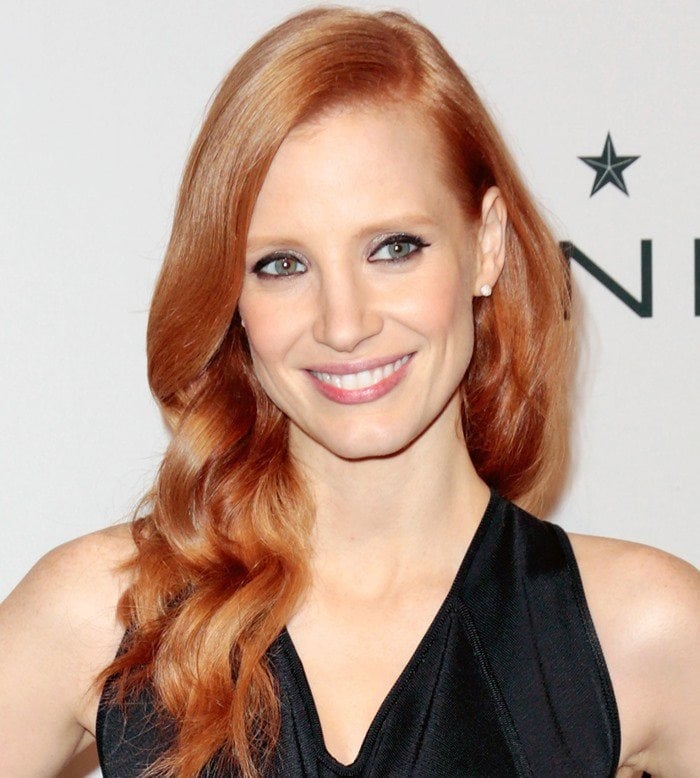 Jessica Chastain's signature red hair with 1940s-inspired waves